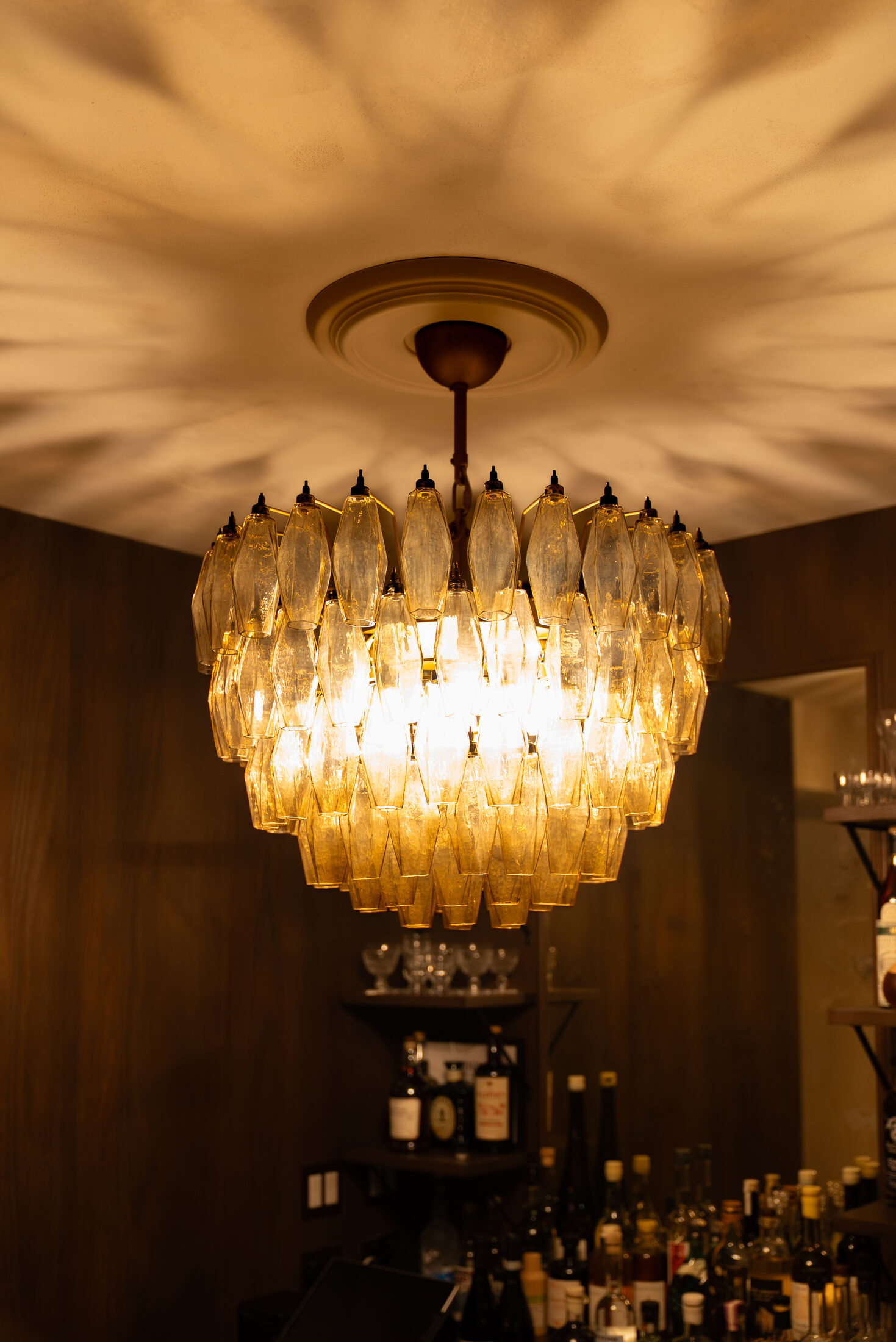 The chandelier above the bar